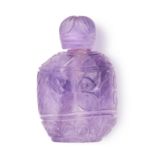 A CARVED AMETHYST SCENT BOTTLE carved with Gaelic design, 9.2cm, 330.2g.