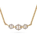 CARTIER, A DIAMOND PENDANT NECKLACE in 18ct yellow gold, comprising three oval buckles set with r...