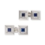 A PAIR OF FRENCH SAPPHIRE AND DIAMOND CUFFLINKS each set with a square step cut sapphire in a bor...