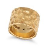 KUTCHINSKY, A MODERNIST GOLD BAND RING, 1967 in 18ct yellow gold, the wide band with a hammered d...