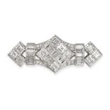 A DIAMOND BROOCH in platinum, in geometric design, set throughout with carre, baguette and round ...