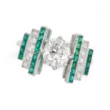 A DIAMOND AND EMERALD DRESS RING in platinum, set with an old cut diamond of approximately 1.35 c...