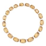 AN ANTIQUE VICTORIAN CITRINE RIVIERE NECKLACE, 19TH CENTURY in yellow gold, set with a row of gra...