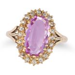 A PINK TOPAZ AND DIAMOND CLUSTER RING in yellow gold, set with an oval cut pink topaz of approxim...