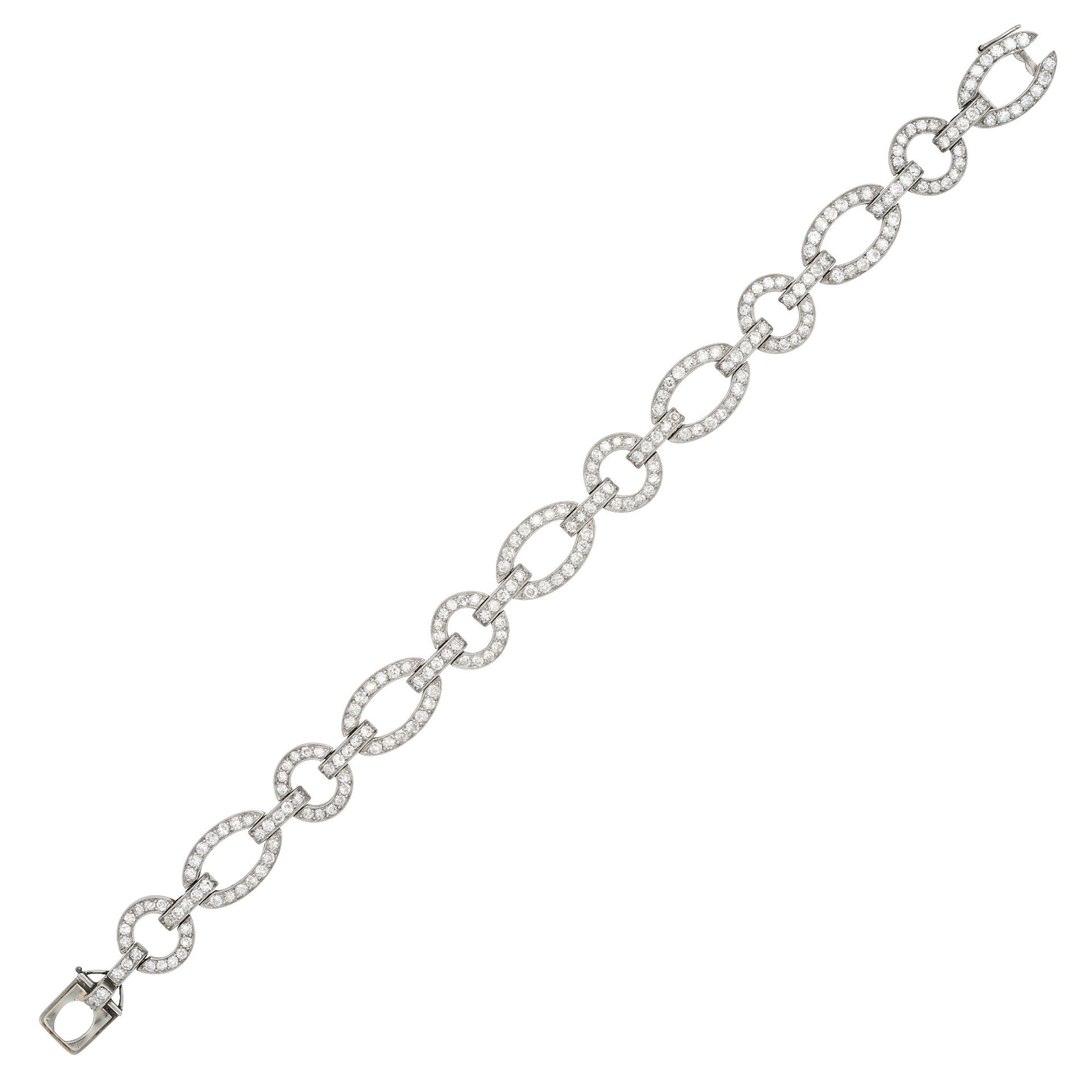 CARTIER, AN ART DECO DIAMOND BRACELET in platinum and white gold, comprising a row of oval and ci...