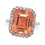 AN IMPERIAL TOPAZ AND DIAMOND RING in platinum, set with an octagonal step cut orange topaz of 8....