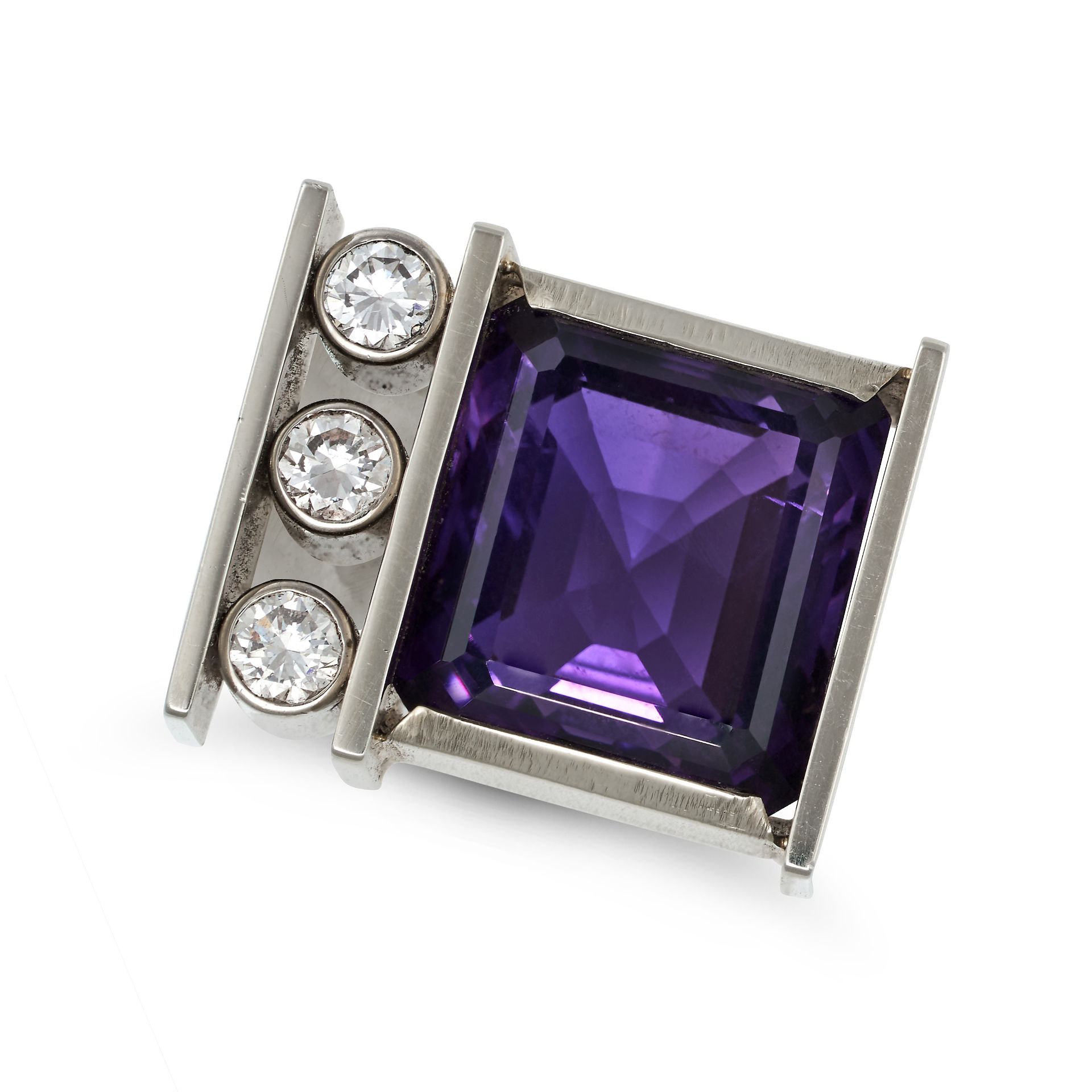A MODERNIST AMETHYST AND DIAMOND DRESS RING in 18ct white gold, the modernist ring set with an oc...
