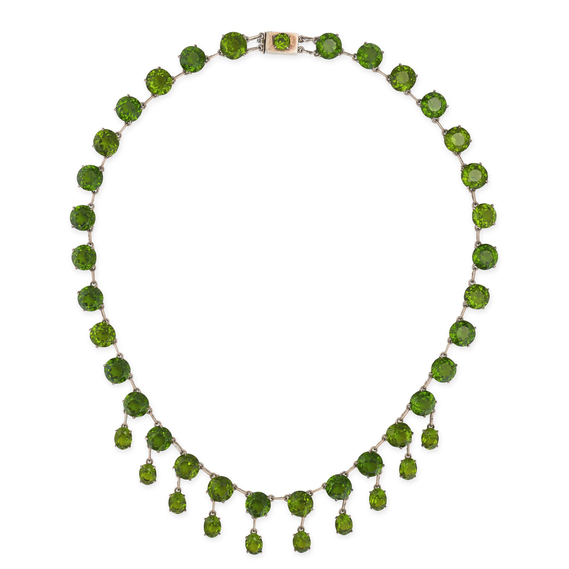 AN ANTIQUE GREEN PASTE FRINGE NECKLACE in silver, comprising a row of round cut green paste stone...