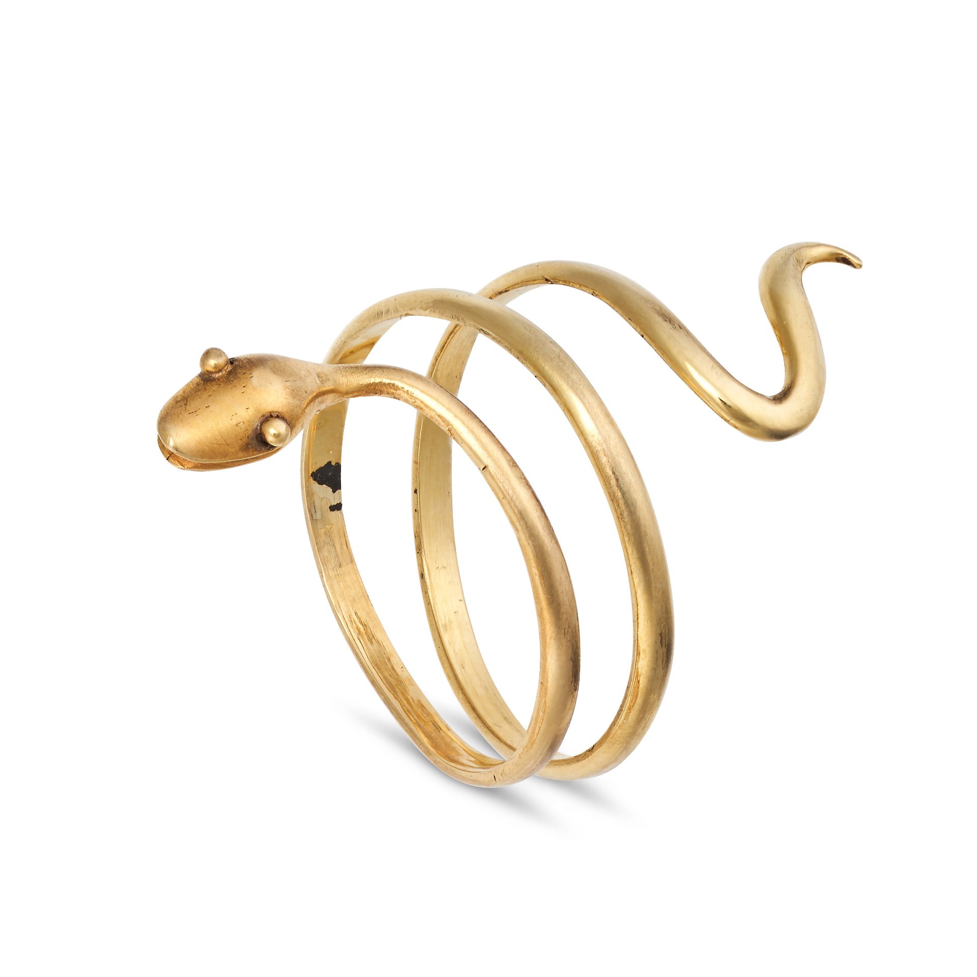 A GOLD SNAKE RING in yellow gold, designed as a coiled snake, no assay marks, size M1/2 / 6.5, 2....