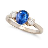 A SAPPHIRE AND DIAMOND THREE STONE RING in 18ct yellow and white gold, set with an oval cut sapph...