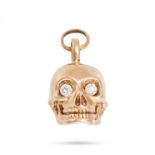 A DIAMOND SKULL CHARM / PENDANT in 9ct yellow gold, designed as a skull, the eyes set with round ...
