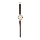 AN ANTIQUE WRISTWATCH in 9ct gold, the white enamel dial with arabic numerals, the double hinged ...