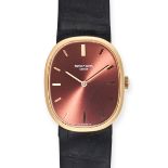 PATEK PHILIPPE - A PATEK PHILIPPE ELLIPSE WRISTWATCH in 18ct yellow gold, 3648, the red/bronze su...