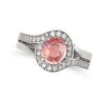 A CEYLON NO HEAT PADPARADSCHA SAPPHIRE AND DIAMOND RING in platinum, set with a cushion cut padpa...