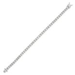 A DIAMOND LINE BRACELET in 18ct white gold, comprising a row of round brilliant cut diamonds, the...