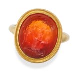 AN ANTIQUE CARNELIAN INTAGLIO RING in 18ct yellow gold, set with carnelian intaglio carved to dep...