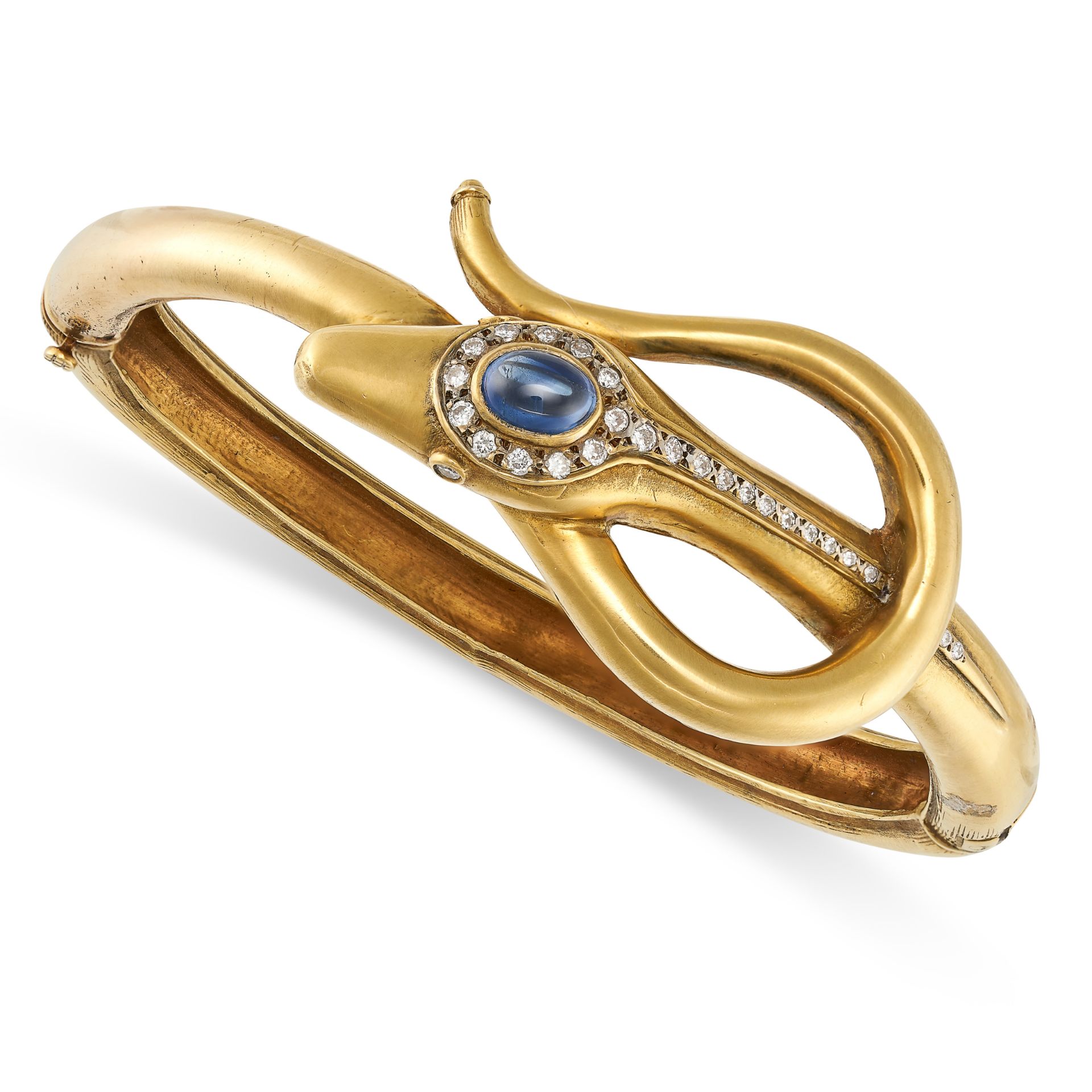 A SAPPHIRE AND DIAMOND SNAKE BANGLE in 18ct yellow gold, designed as a snake coiled around itself...