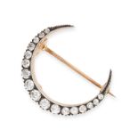 AN ANTIQUE DIAMOND CRESCENT MOON BROOCH in yellow gold and silver, designed as a crescent moon se...
