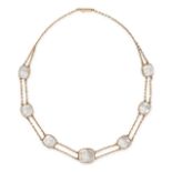 AN ANTIQUE ROCK CRYSTAL NECKLACE in yellow gold, comprising two rows of trace chains set with sev...