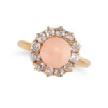 AN ANTIQUE CORAL AND DIAMOND CLUSTER RING in 22ct yellow gold, set with a cabochon coral in a clu...