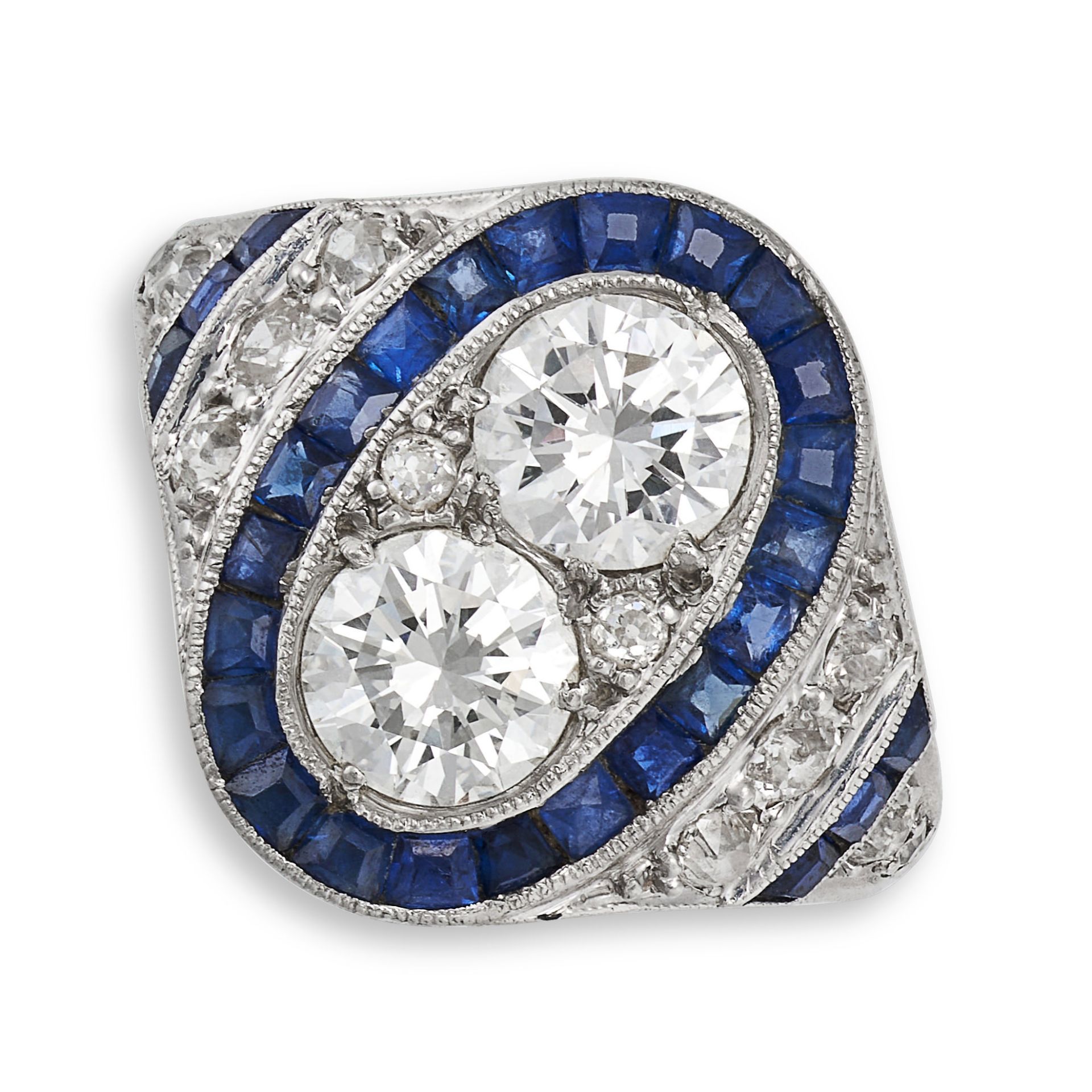 A SAPPHIRE AND DIAMOND DRESS RING in platinum, set with two round brilliant cut diamonds totallin...