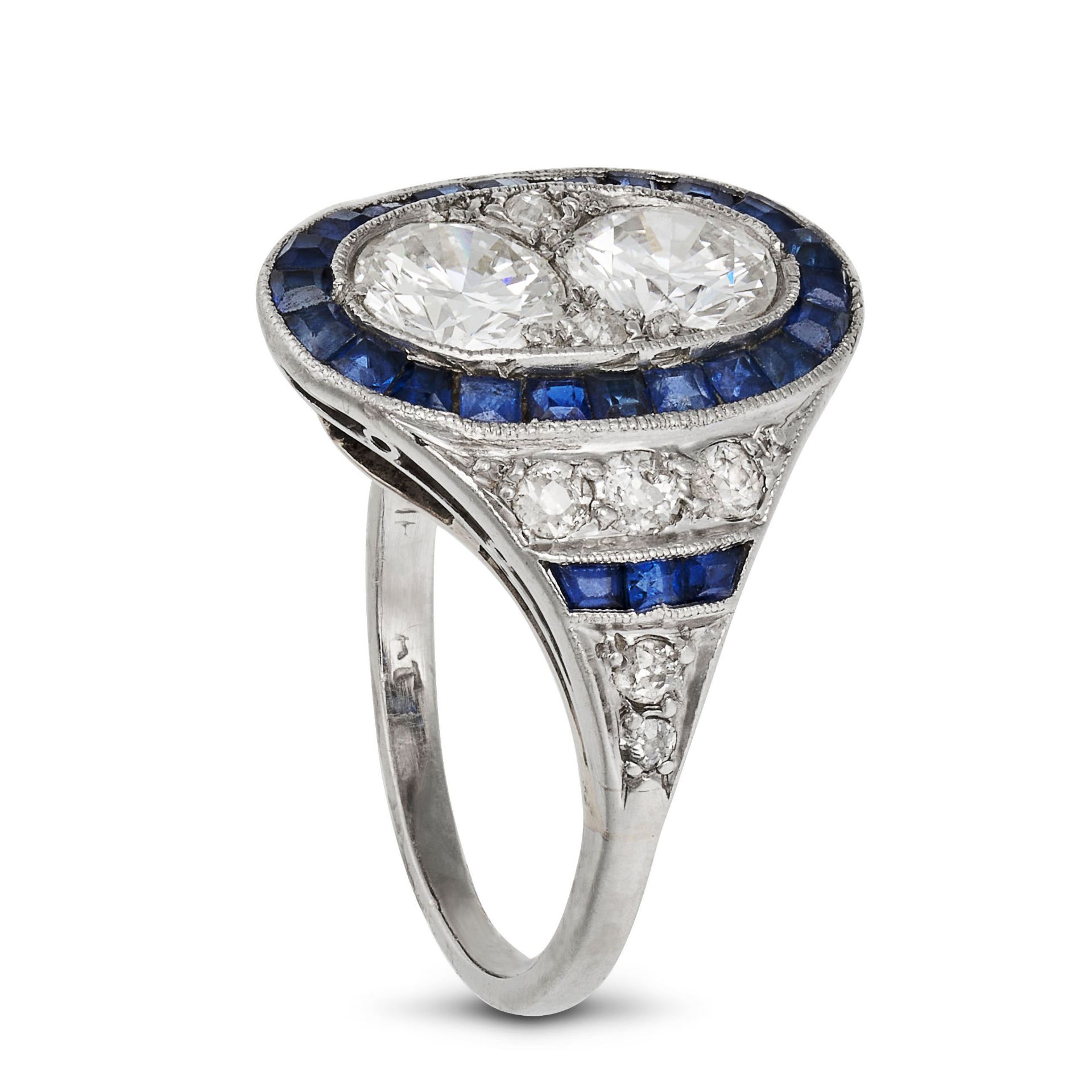 A SAPPHIRE AND DIAMOND DRESS RING in platinum, set with two round brilliant cut diamonds totallin... - Image 2 of 2