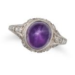 A PURPLE STAR SAPPHIRE AND DIAMOND RING in platinum, set with an oval cabochon purple star sapphi...