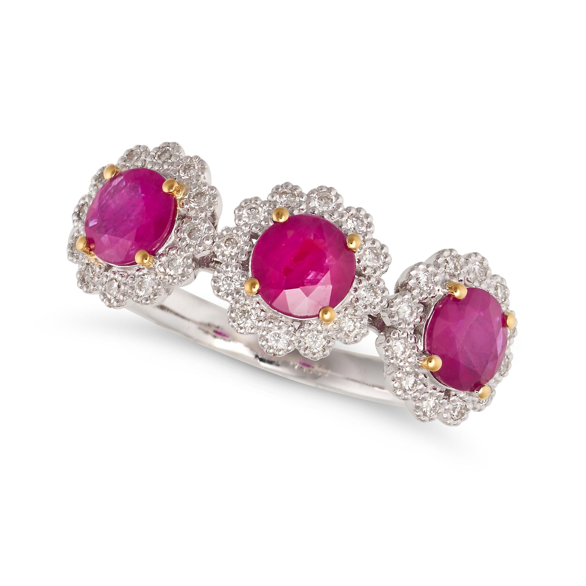 A RUBY AND DIAMOND CLUSTER RING in 18ct white gold, set with three round cut rubies in clusters o...