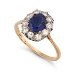 A SAPPHIRE AND DIAMOND CLUSTER RING in 18ct yellow gold and platinum, set with a cushion cut sapp...