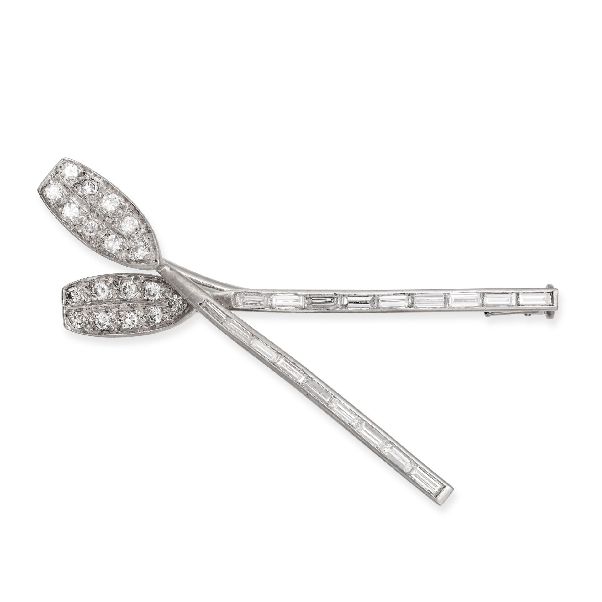 A DIAMOND OARS BROOCH in white gold, designed as two crossed rowing oars, set with round brillian...