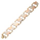 A TRICOLOUR GOLD BRACELET in yellow, rose and white gold, comprising a row of rectangular and ope...