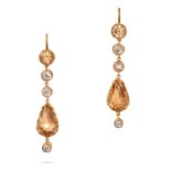 A PAIR OF GOLDEN TOPAZ AND DIAMOND DROP EARRINGS in yellow gold, each comprising a row of round c...