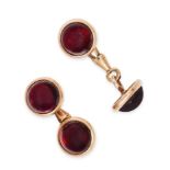 A PAIR OF ANTIQUE GARNET CUFFLINKS in yellow gold, each set with two round cabochon garnets, Aust...