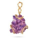 A MODERNIST AMETHYST BROOCH/PENDANT in 18ct yellow gold, set with a rough amethyst crystal in a s...