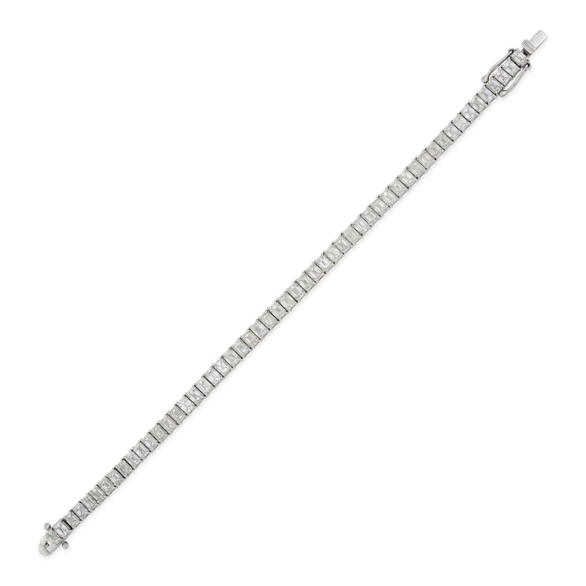 A DIAMOND LINE BRACELET in platinum, set with a row of emerald cut diamonds all totalling 16.10 c...