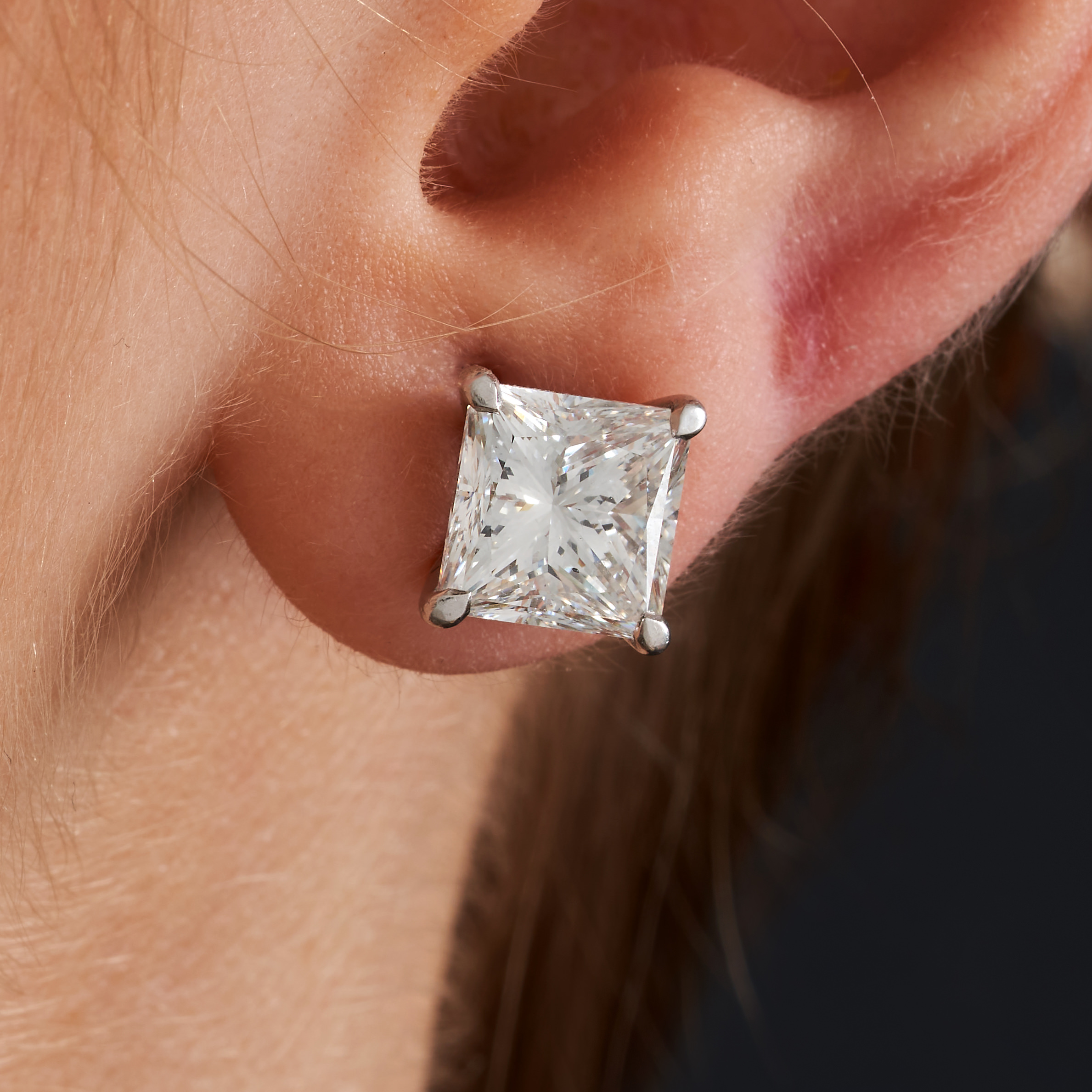 A PAIR OF F COLOUR DIAMOND STUD EARRINGS in 18ct white gold, each set with a princess cut diamond... - Image 2 of 2