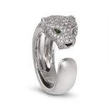 CARTIER, A DIAMOND, TSAVORITE GARNET AND ONYX PANTHERE RING in 18ct white gold, designed as a coi...