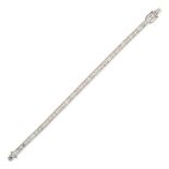 A DIAMOND LINE BRACELET in 18ct white gold, set with a row of baguette cut diamonds all totalling...