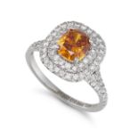 A FANCY INTENSE YELLOW ORANGE DIAMOND RING in platinum, set with a cushion cut fancy intense yell...