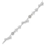 A DIAMOND BRACELET in 18ct white gold, comprising floral clusters and domed links, set throughout...