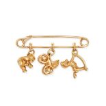 CARTIER, A VINTAGE CHARM BROOCH in 18ct yellow gold, designed as a safety pin suspending three ch...