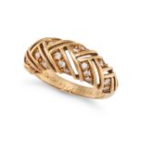 CARTIER, A DIAMOND DRESS RING in 18ct yellow gold, the openwork ring in bombe design, set with ro...