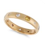 A DIAMOND BAND RING in yellow gold, set with round brilliant cut yellow and white diamonds, no as...