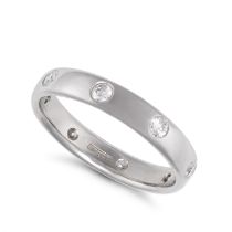 A DIAMOND BAND RING in platinum, set with a row of round brilliant cut diamonds, partial British ...