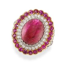 NO RESERVE - A RUBY AND DIAMOND DRESS RING in yellow gold and silver, set with an oval cabochon r...