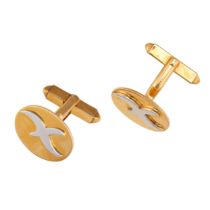 GARRARD, A PAIR OF GOLD CUFFLINKS in 9ct yellow and white gold, each oval face with a stylised X ...