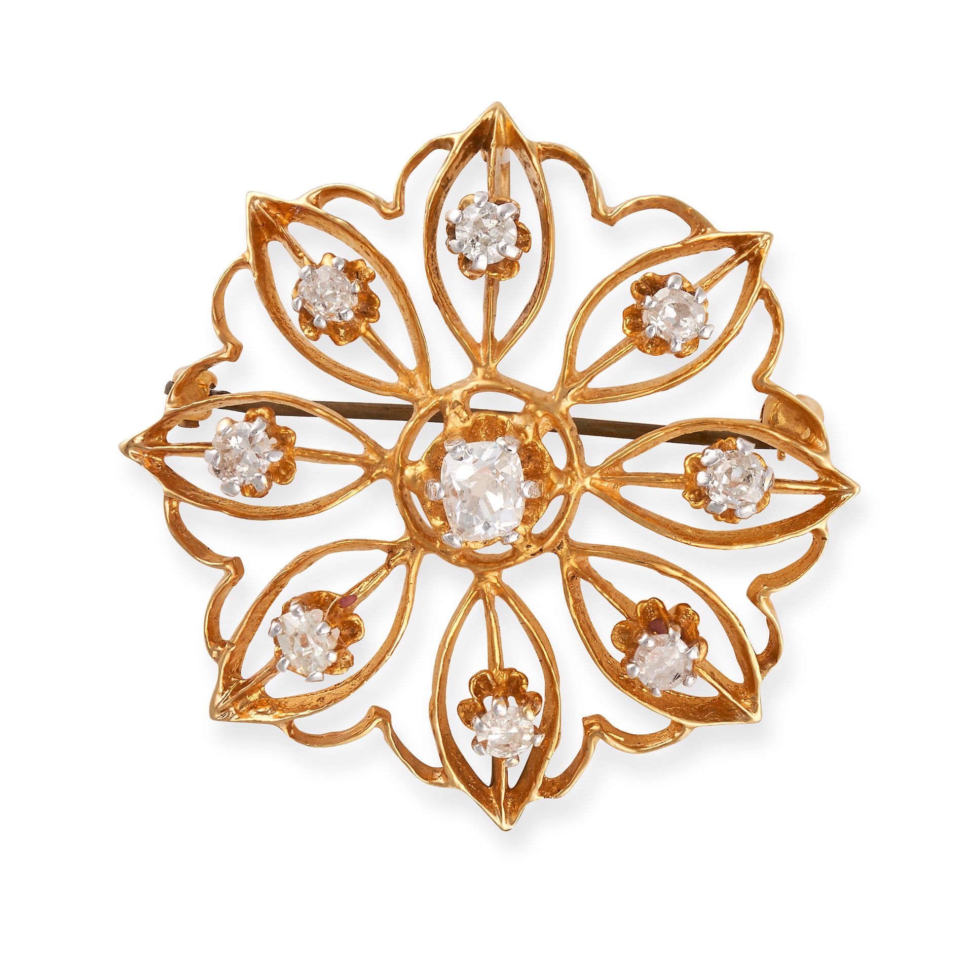 NO RESERVE - A DIAMOND FLOWER BROOCH / PENDANT in yellow gold, designed as an openwork stylised f...