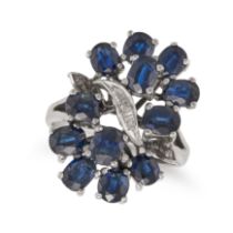 A SAPPHIRE AND DIAMOND DRESS RING in 18ct white gold, set with a cluster of cushion cut sapphires...