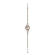 A DIAMOND COCKTAIL WATCH in platinum and 9ct white gold, the circular white dial with pencil mark...