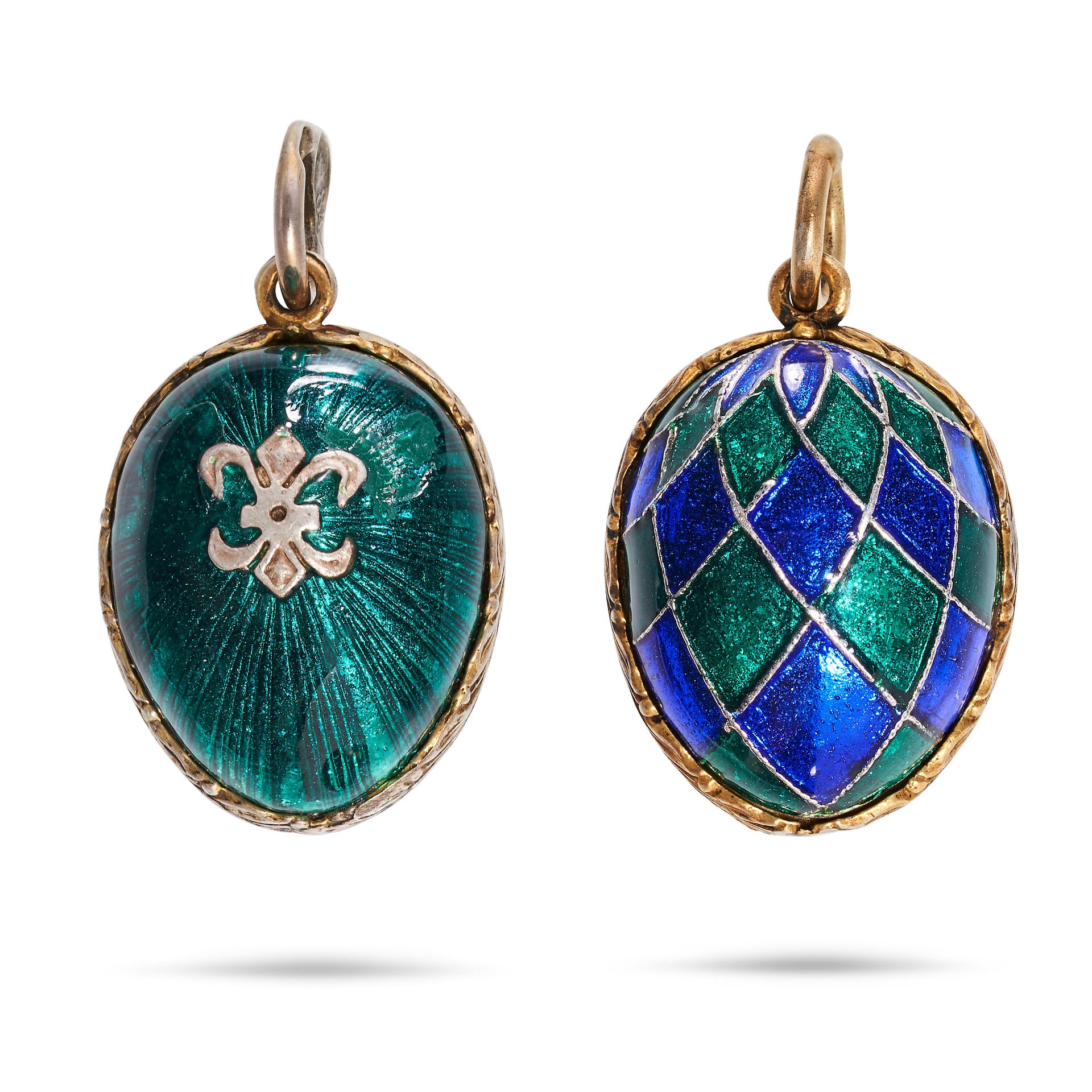 NO RESERVE - TWO ENAMEL EGG CHARMS / PENDANTS in silver gilt, one relieved in emerald green guill...